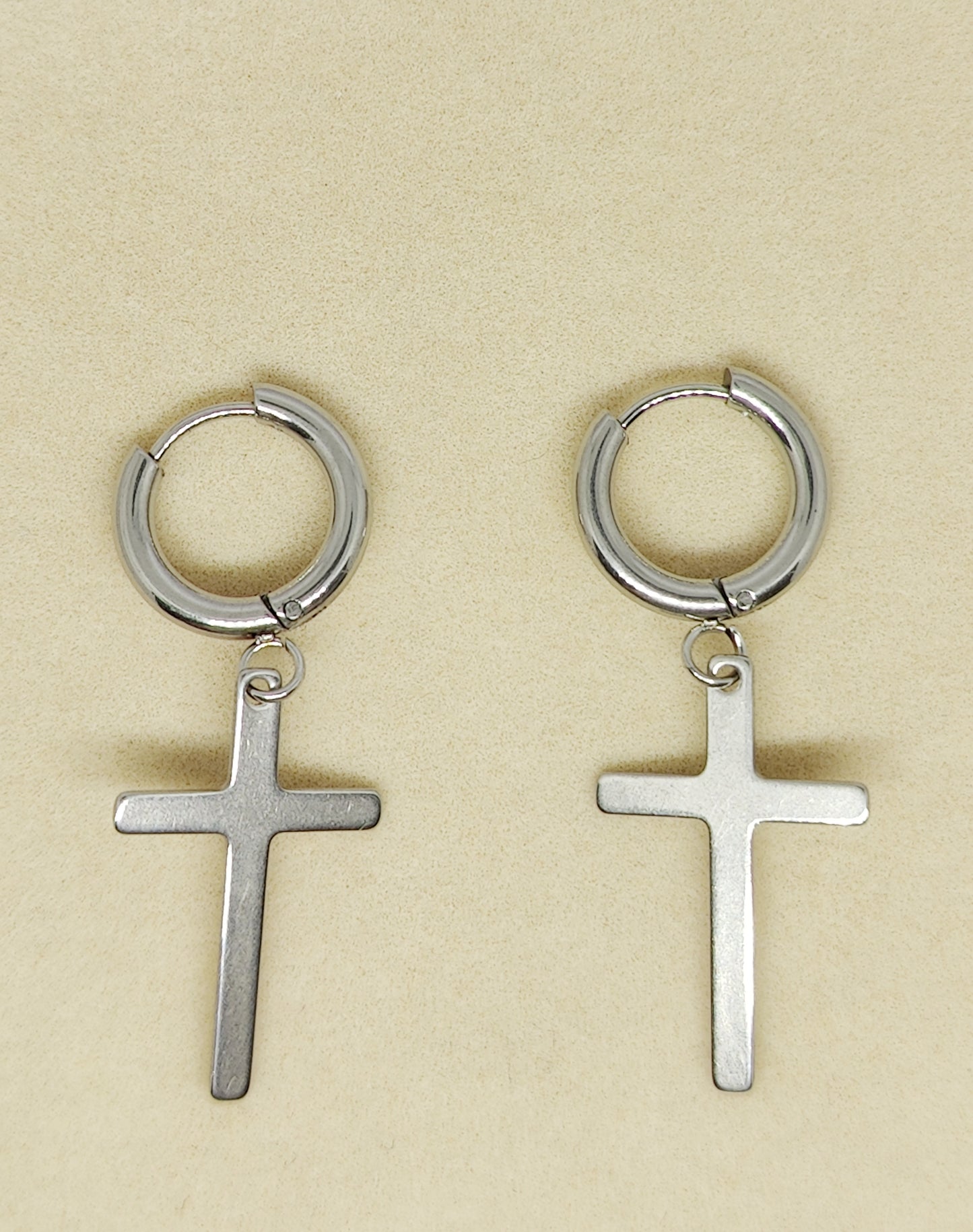 Round earrings with thin cross pendant