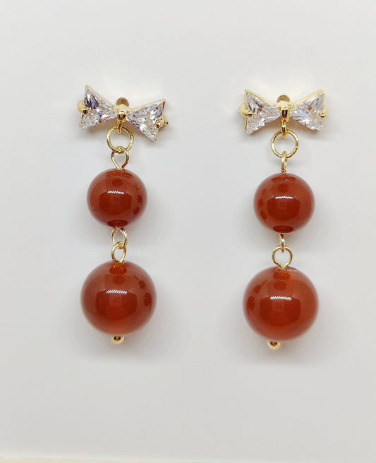 Bow-Shaped Zircon Stud Earrings with Red Stone Bead Accents