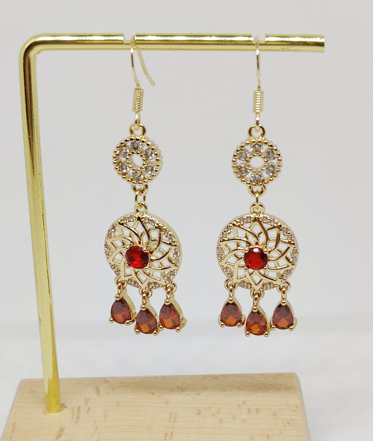 Three Swinging Zircons Suspended Beneath a Zircon-Encrusted Round PendanT Earrings