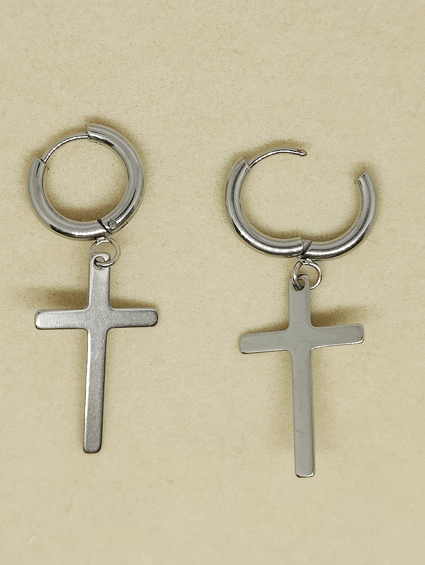 Round earrings with thin cross pendant