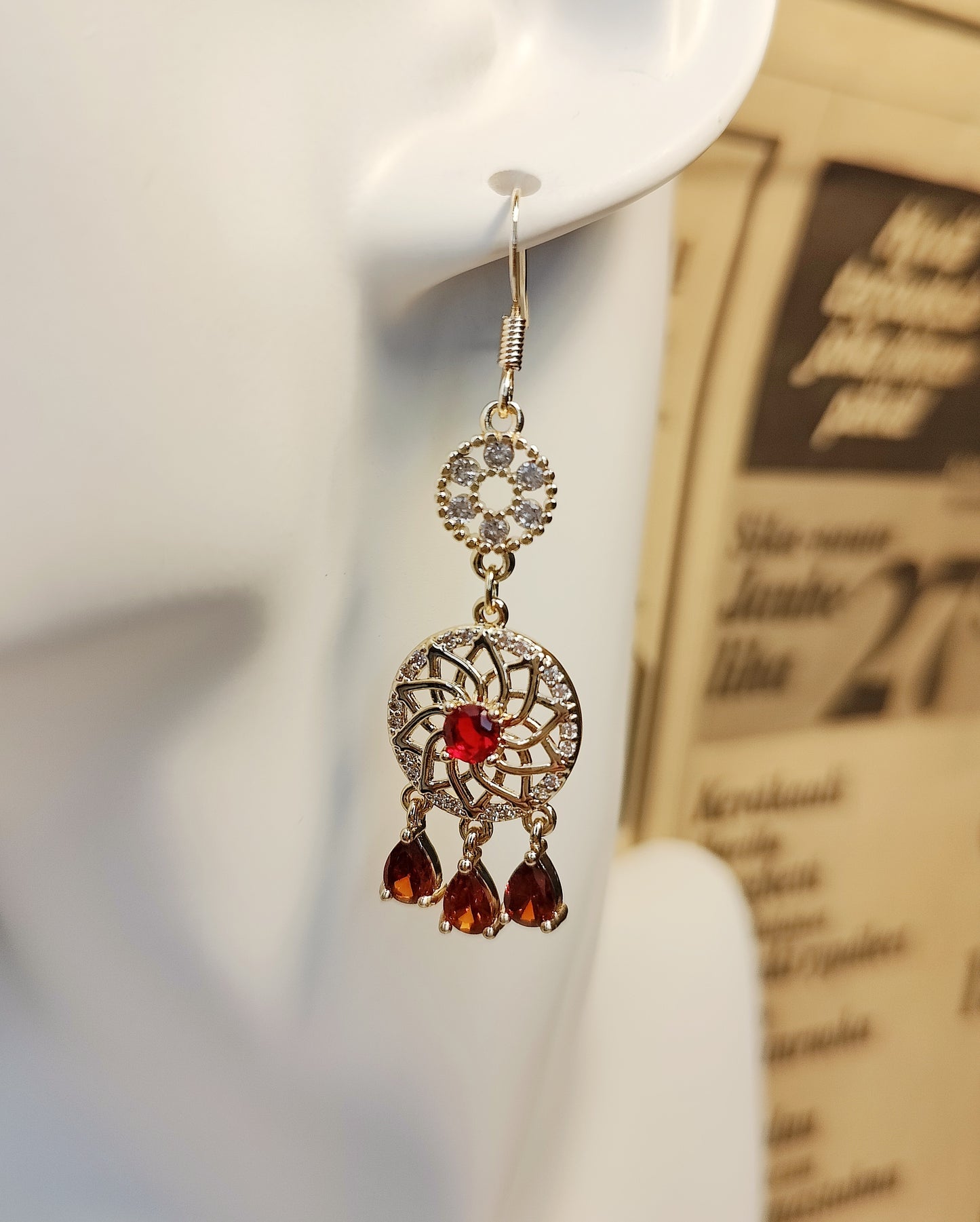 Three Swinging Zircons Suspended Beneath a Zircon-Encrusted Round PendanT Earrings