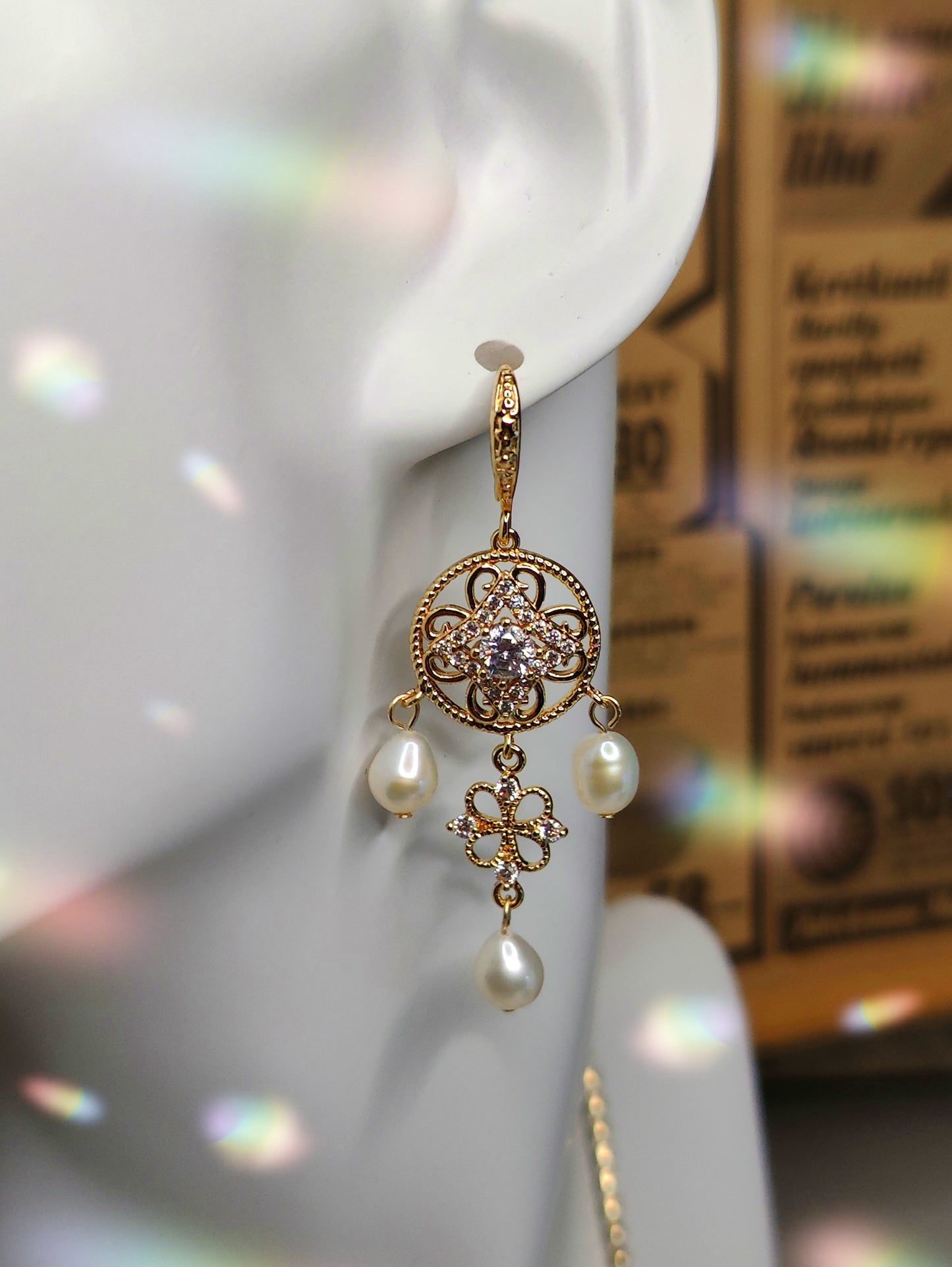 Earrings with Zircons Embedded in Round Pendant and Three Pearls